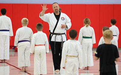 Alliance Police Officer Roy Tittle coaches students in the Kick Drugs Out of Alliance program, which he runs.