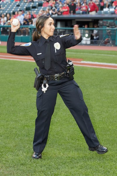 Sarah Shendy, OPOTA trainer and Copley police officer, throws out an opening pitch for the Cleveland Indians in 2019. [Photo from the Cleveland Indians]